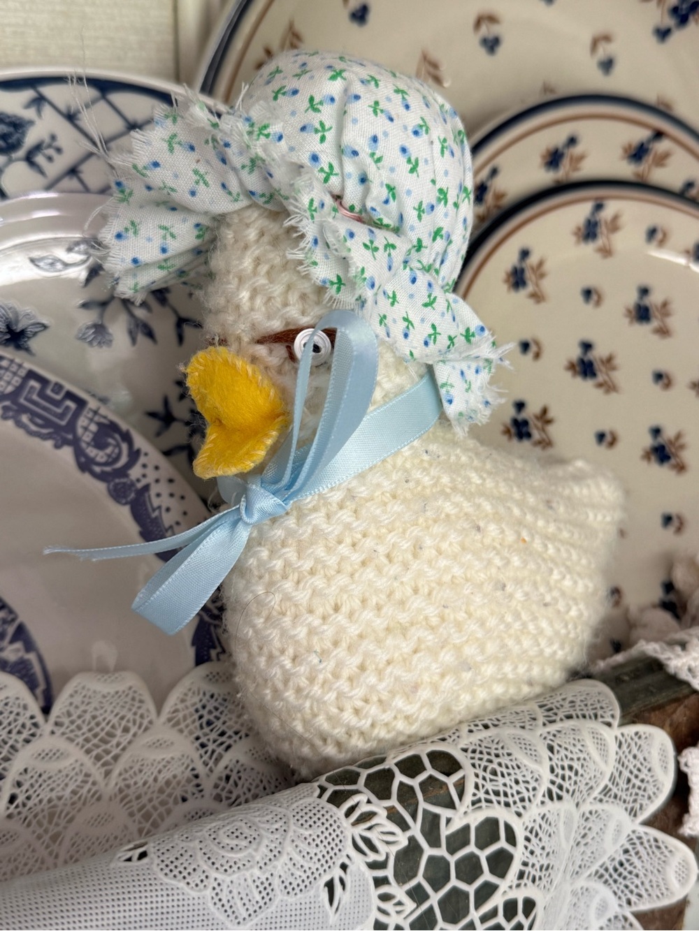 Handmade Cream Knitted Duck Plush with Blue Ribbon and Floral Bonnet